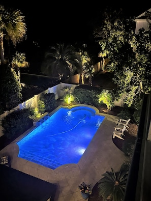 Nighttime view of private pool