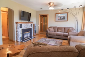 Living Room with gas fireplace and Roku TV