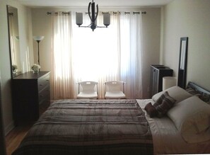 Bedroom #1. Tranquil and serene. Queen size bed and offers a walk-in closet.