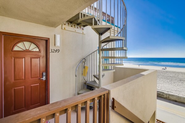 Front entrance to Rich's Beach Bungalow and winding staircase to private rooftop balcony