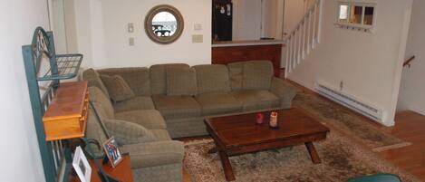 Spacious living room with pull out couch and coffee table that expands