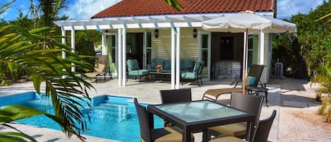 Experience the epitome of privacy with a cottage that boasts a personal pool and outdoor dining on the patio