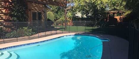 Backyard, with a gorgeous pool and a gazebo.