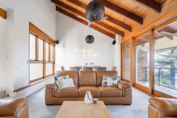 Large living and dinning room which opens up to a ocean view balcony. 