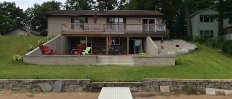 View from the dock to lower patio and upper deck