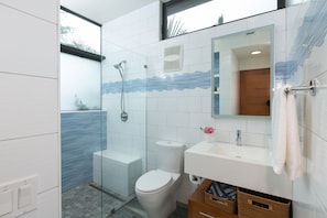 Large full bathroom with glass shower