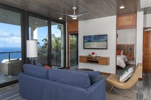 Living area with couch and Smart TV with Dish Network