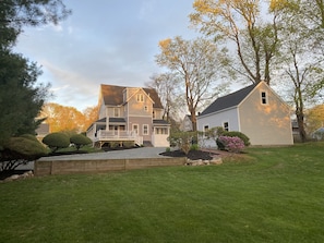 Exterior view from large private backyard with ample off-street parking