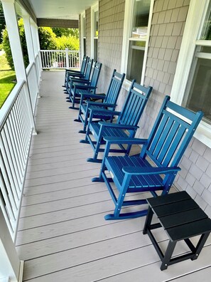 Covered porch with rockers for relaxation