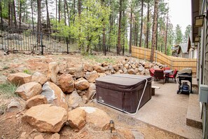 Fully fenced in backyard with newer hot tub!