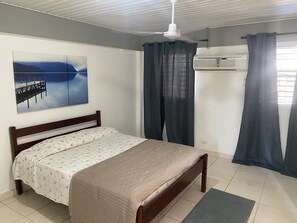 Spacious bedroom with one Queen bed, AC and closet