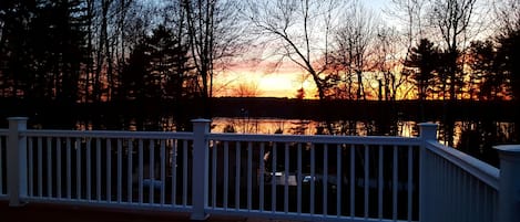 Enjoying a glass of wine with an amazing sunset view on our oversized deck!