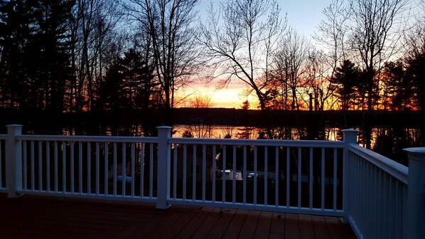 Enjoying a glass of wine with an amazing sunset view on our oversized deck!