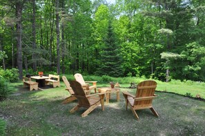 Side yard seating and dining area, adjacent to house and barbecue