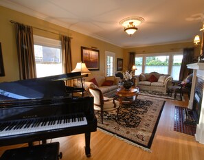 Elegant living room with baby grand piano