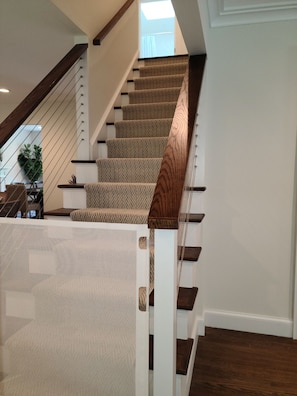 baby gates provided at top and bottom of stairs helps keep little ones safe.