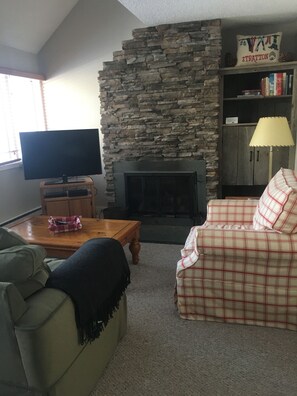 Cozy family room with wood burning FP