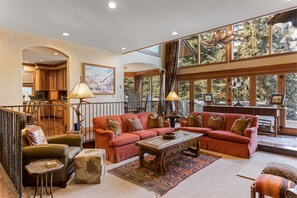 Expansive windows frame this living room