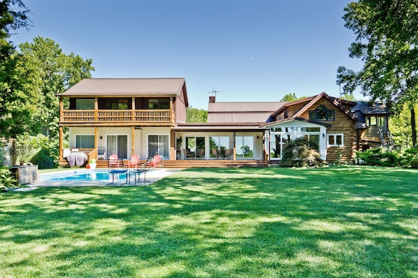 Enjoy views of the Chesapeake Bay, pool and garden through a wall of glass!