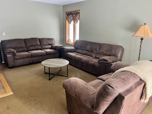 Living room with two sofas and a loveseat.