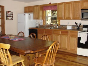 A counter with multiple work areas for efficient meal preparation.