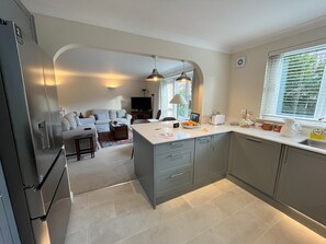 Open plan kitchen with breakfast bar