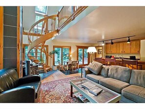 FIRST FLOOR DEN WITH VIEW OF STAIRS