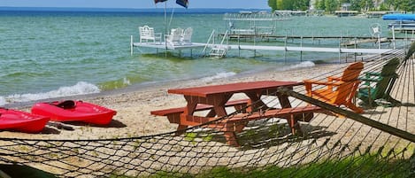 Shady hammock overlooking Burt Lake on a sandy beach