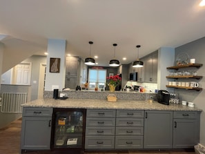 View from dining area into kitchen. Great Buffet counter with coffee nook! 