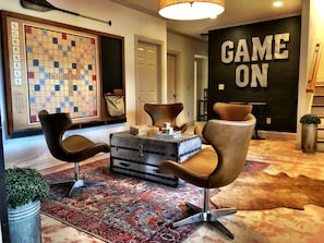 Newly added terrace game room w roku tv, electronic fireplace, and game console