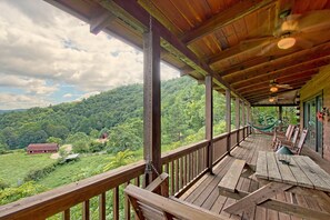 Picnic table, swing, hammock on porch with speculator mountain views