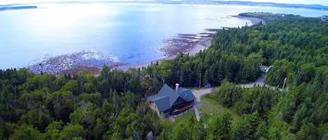 Secluded log home with amazing ocean views and private, sandy beach