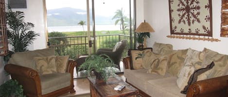 Oceanview living room decorated island style.. 
