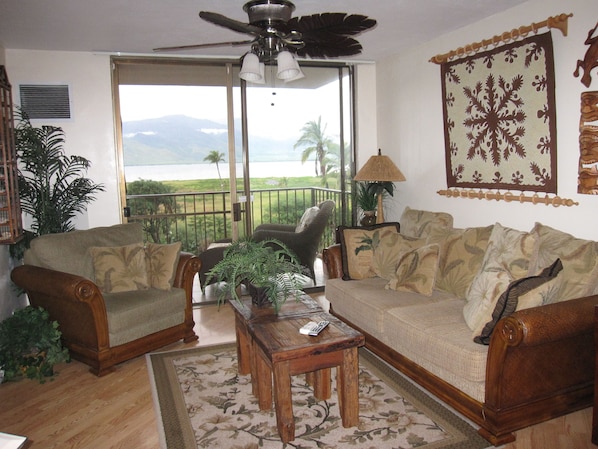 Oceanview living room decorated island style.. 
