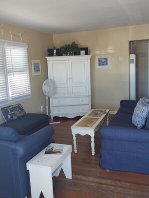 Living room with TV in armoire