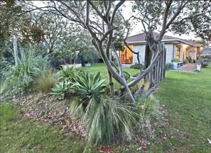 Front yard with sprawling lawn to relax in. Lie in Hammock under tree. 