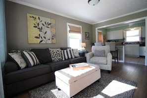 Living area with LED TV/sound bar and a Roku player