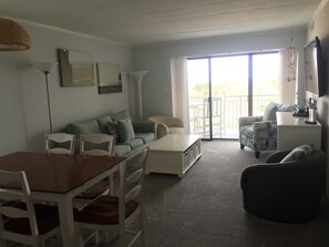 Living and dining room, dunes beyond the door.