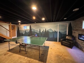 Newly renovated basement(May 2024), Mountain wall and fireplace stone mural.