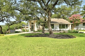 Drive up to the corner white stucco -Texas limestone modern home on 1/3 acre.