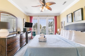 Primary bedroom complete with a king bed, porch access and a smart TV.