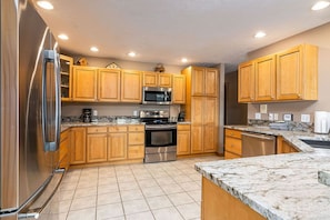 42" cabinets, stainless steel appliances, large farm sink with commercial faucet