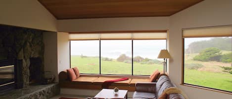 Family Room with view to bluff and ocean.  We supply the wood for the fireplace