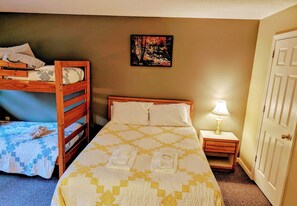 Queen Bed and twin bunk beds with private bedroom