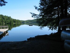Beach area Lake Raponda, canoe stored at beach. 