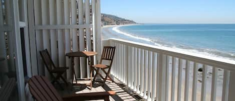 Sweeping coastline view from the deck just steps away from the beach!