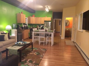 Kitchen / Living and Dining area, to the right is a full bathroom