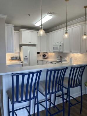 kitchen bar seating and dining area as well