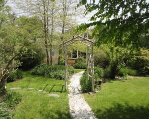 Seashell path leads back to cottage.  A quiet, private, very green oasis. 