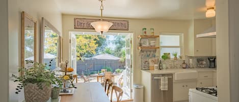 Bright clean and updated kitchen leading to the private yard